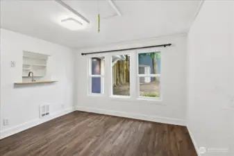 Cottage with overhead pull-down stairs to small loft