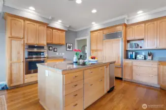 A thoughtfully designed layout offers abundant cabinetry and expansive countertop space.