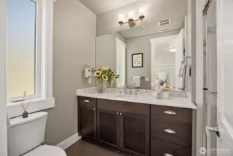 En-suite 3/4 bathroom in the second bedroom.