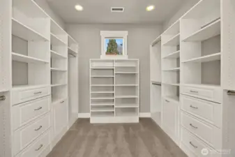 The dreamy walk-in closet has room for all of your favorite things, along with natural light to help you choose what to wear.