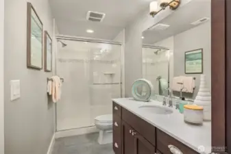 Full guest bath just around the corner from the lower bedroom.