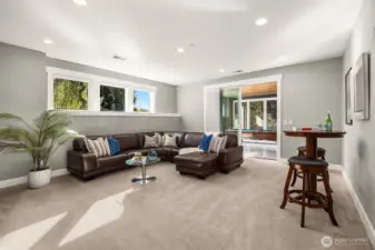 Kick back in the huge rec room opening to the flex room.