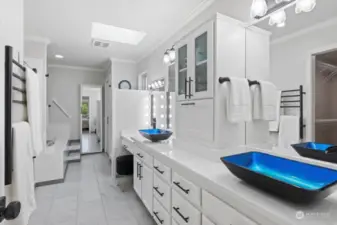 Primary Bath has so many cool cabinets, heated floors + towel bars, and great lighting