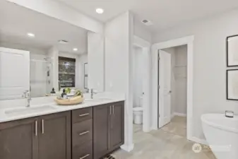 Primary bathroom with double vanity, soaking tub, large walk0in closet. “Photos are for representational purposes only. Colors and options may vary”