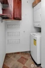 In unit laundry with plenty of room for extra storage.