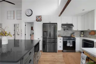 Beautiful quart counter tops, tile back splash and extra cabinetry for plenty of storage.