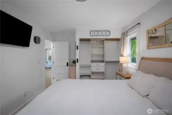 Primary closet with built in organizer.