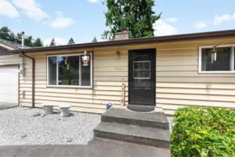 exterior front entry with storm doors