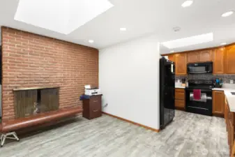 Second cozy wood burning fireplace in dining room area
