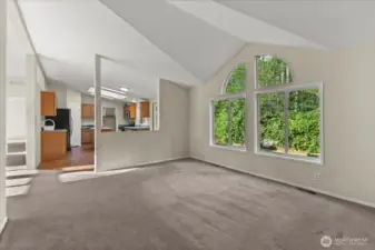 A great view of the back and easy access to the kitchen from the dining room.
