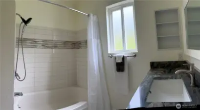 Main floor full bathroom with new cabinet & countertops