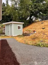 Rear yard fully fenced with garden shed.