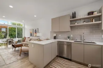 A chef’s dream kitchen with stainless steel appliances, sleek countertops, and custom cabinetry...make sure to look for the custom storage system!