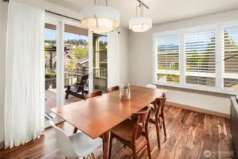 Formal dining adjacent to patio for in/outdoor vibe
