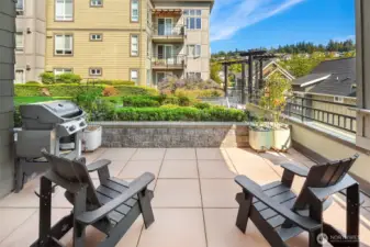Generous patio space faces out to peaceful courtyard.