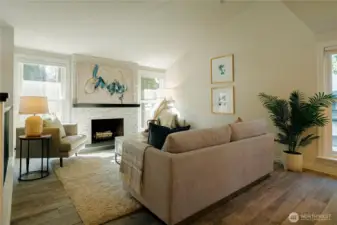 Vaulted living room with fireplace