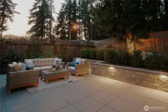 Outdoor lighting throughout backyard hardscape and landscaping