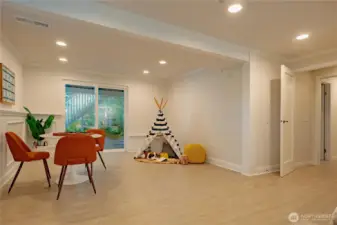 Lower level rec room showing the sliding door access to the backyard.