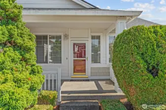 Welcoming covered front entry with spacious porch.  Lots of windows and full-paned storm door offers lots of northwestern facing afternoon natural light.