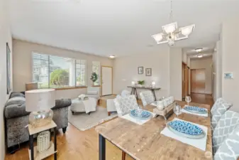 View to hallway that leads to a primary with en-suite, 2 guest bedrooms, full bathroom,2 storage closets, and laundry room.