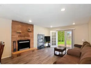 Wood burning fireplace. French doors to the patio and backyard.