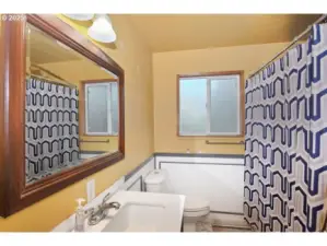 Main bathroom with shower and tub.