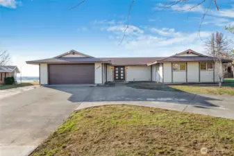 New landscape rocks and grass seed have just been put in for a spring lawn.