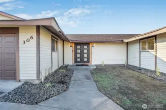 Low maintenance entryway for this beautiful home with new security double doors.