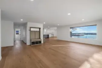 Enter the great room and go straight into the dining room and kitchen. Full guest bathroom is down the hall.