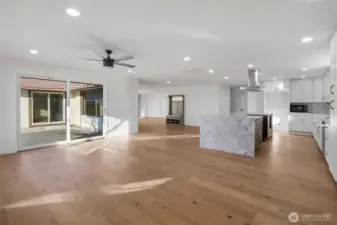 The oversized sliding glass doors lead out to the private back patio and back yard with a trail that leads to the boathouse.