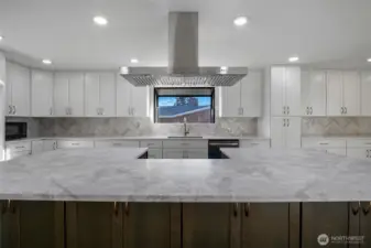 Let's eat!!  Fill this island with food and have a large gathering!  (Stove to be installed!) White upper cabinets and rich brown lower island cabinets appeal to your monochromatic style!