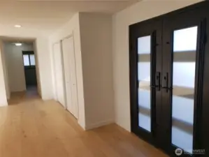 Down the hall to the bedrooms. The primary suite is to the left, and the other three bedrooms are straight ahead and spread out. (See last photo of floor plan.)