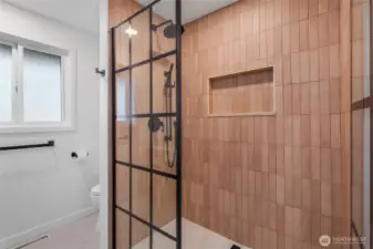 Our contractor said, "I create only high-end, high-class showers, only the best!" And he has done it again in this bathroom where you'll enjoy elegance, privacy, and again, a premium adjustable shower head for a waterfall of water and an oversized nook for your personal items.