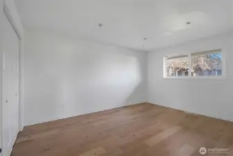 The remodeled fourth bedroom faces the right side of the house and is awaiting the final stages of electrical lighting to be installed.