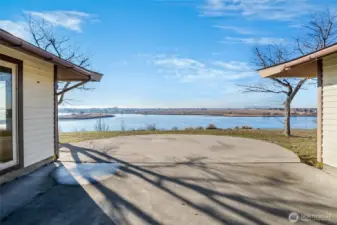 What a beautiful sunny day!  This was a day full of special memories for this real estate agent, and sun and lake are the perfect balm for a beautiful and private space behind this home to enjoy and contemplate life! You can even set up a large umbrella in the center of the round patio for times when you need some shade, but otherwise, wow, what a beautiful view of the lake!