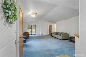 Enter into a very spacious main living room with a vaulted ceiling. The entire interior of this home has been freshly painted.