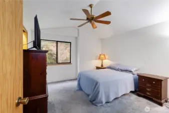 Primary bedroom with high ceilings, a walk-in closet and an en suite bath.