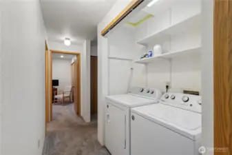 Laundry is located in the hall.