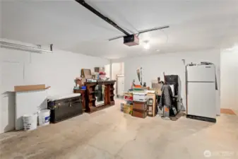 Large garage with a staircase on the right that leads up to the 2nd living room.