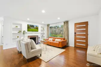 Clean lines meet warm finishes, creating an immediate feeling of comfort and quiet luxury. Check out that gorgeous solid walnut front door!