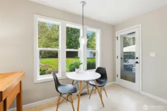 The adjoining eating area adds warmth and functionality, making it a natural everyday hub.