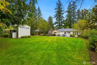 The grounds feel like a private retreat, with lush, established gardens and mature landscaping throughout.