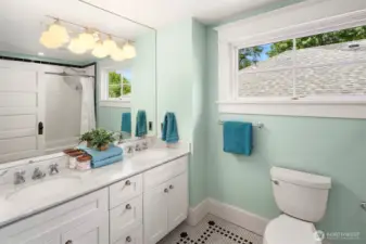 The top floor bathroom has been fully remodeled (studs out) and has double sinks, custom lighting and period details.