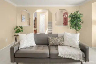 Family room w Stairs to the 4 bedrooms and hallway to the fireplace room