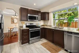 Kitchen w Fun Garden window to the backyard