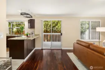 Den area from the Half bath and door to 3 car garage