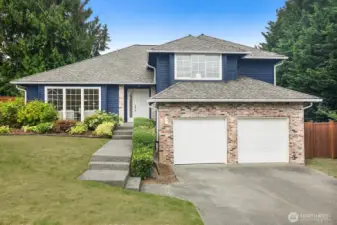 6342 S 298th Place sits elegantly on a corner lot in the hillside cul-de-sac of Bristol Heights.