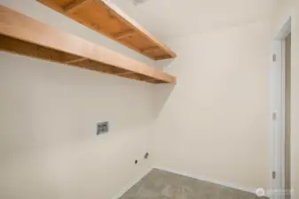 The large laundry room is adjacent to the kitchen for great convenience and efficiency.