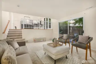 The cozy family room enjoys a gas fireplace and sliders out to the backyard and patio.