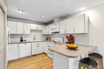 Kitchen has brand-new Microwave, Garbage Disposal, Faucet, and Subway Tile Backsplash Wall.